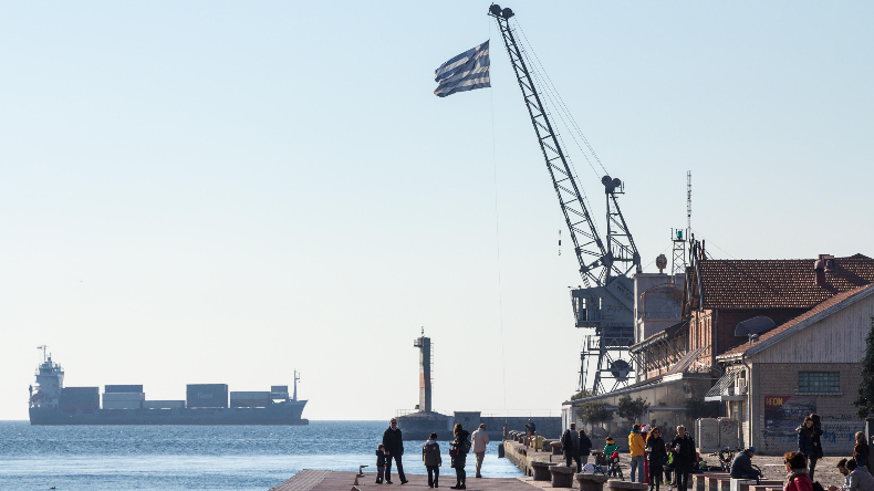 Greek flag on dock in Thessaloniki cargo ship