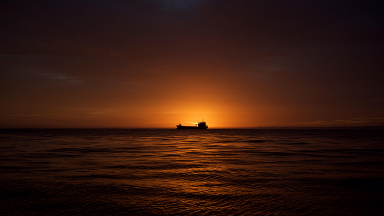 Oil tanker silhouette at sunset