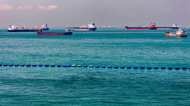 Large numbers of ships waiting at anchor off the coast of Singapore and Malacca Strait