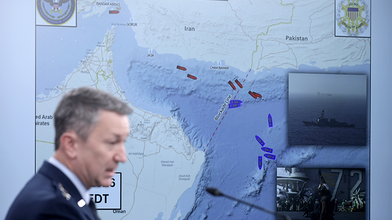 Chairman of the Joint Chiefs of Staff Gen. Dan Caine speaks as he displays a map showing the United States Navy's blockade of the Strait of Hormuz