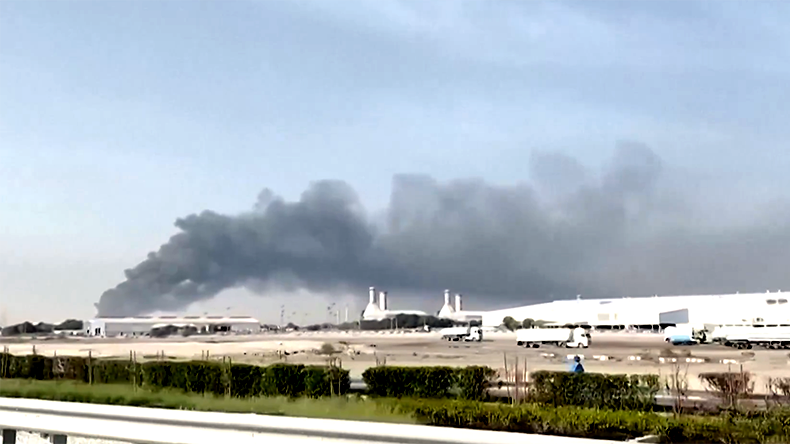 Jebel Ali port with smoke rising