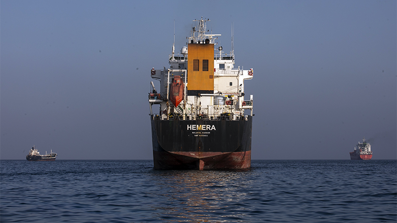 A ship remains anchored on May 16, 2026 in the Strait of Hormuz near Larak Island, Iran