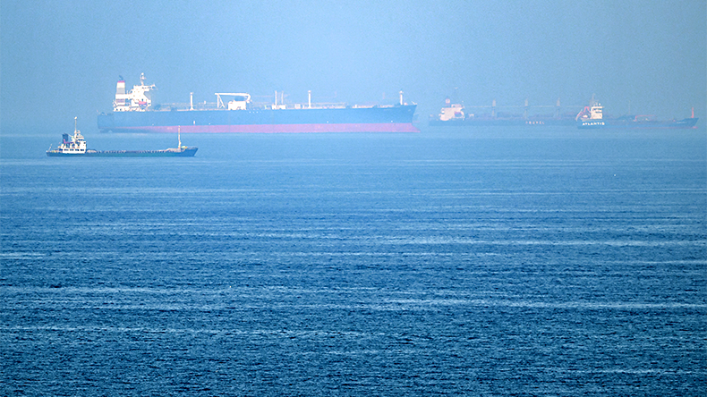 Ships are pictured off cost of the Khor Fakkan Container Terminal, the only natural deepsea port in the region