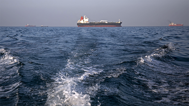 Ships remain anchored on May 16, 2026 in the Strait of Hormuz near Larak Island, Iran