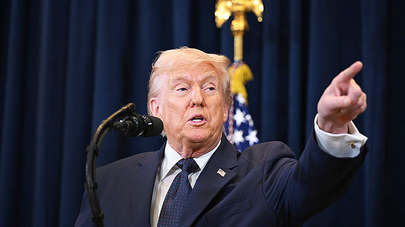 Donald Trump speaks to reporters during a news conference