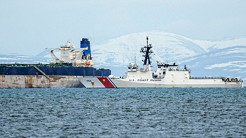A US Coast Guard vessel is seen next to the Marinera oil tanker on January 14, 2026 in Burghead, Scotland. The tanker, previously known as the Bella 1, was seized by US forces on 7 January 2026, between Iceland and Scotland.