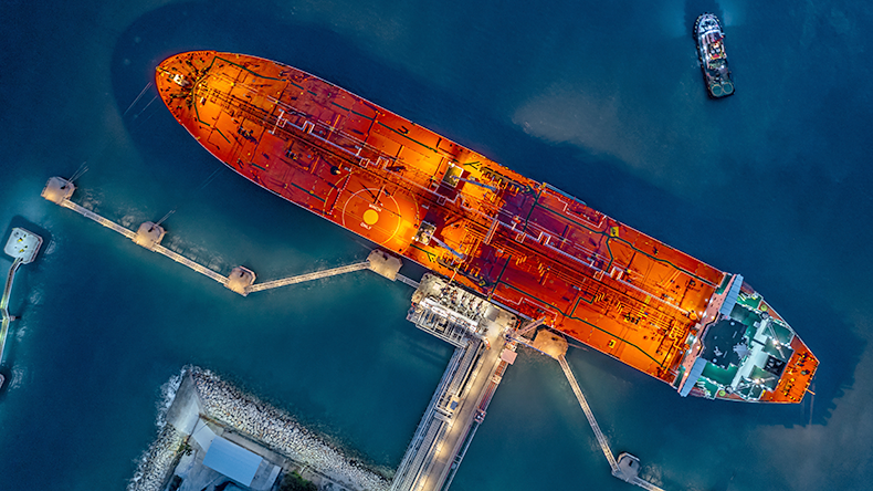 Aerial top view industrial crude oil tanker at terminal industrial port