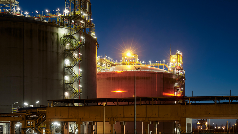 Liquefied natural gas storage tanks at night