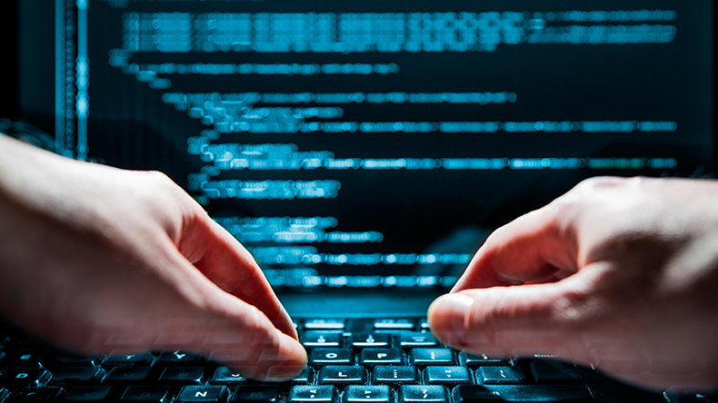 Hacker using laptop