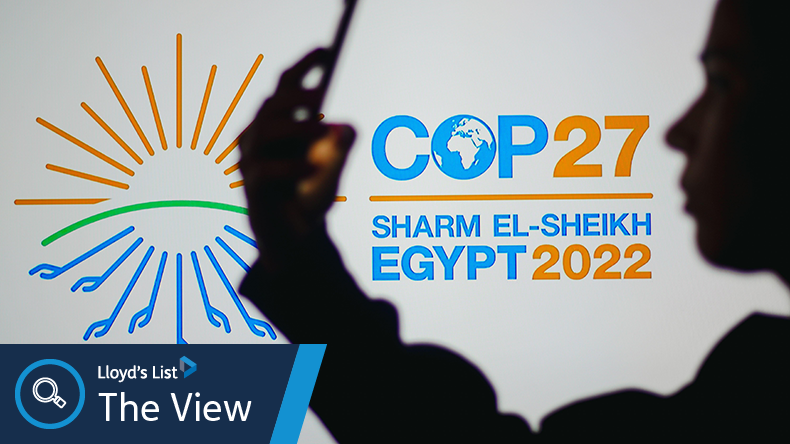 COP27 woman with phone silhouette