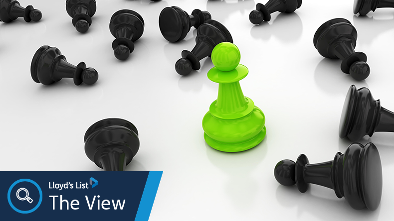 Leadership concept - green chess pawn standing tall