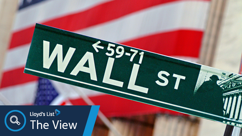 Wall Street NYSE with US flag on its outside