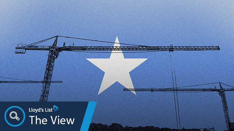 Somalia flag with big cranes, construction industry concept, growth and development in construction