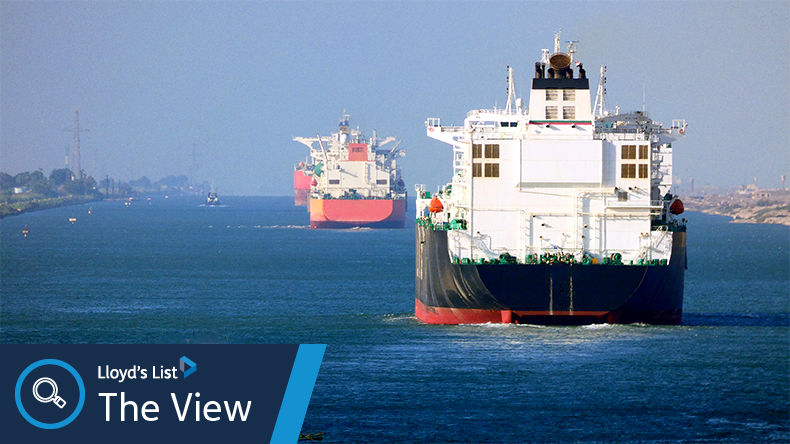 Ships moving along Suez Canal with a clear blue sky