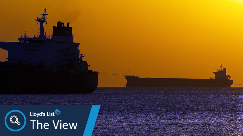 Cargo vessel in the middle of the ocean when it is almost night