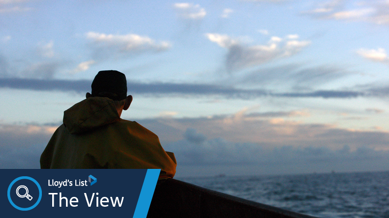 Lone crew member looks out to sea. Credit Willows Photos UK / Alamy Stock Photo