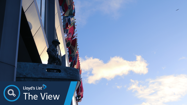 International Maritime Organization HQ with seafarer statue and flags. Credit: IMO