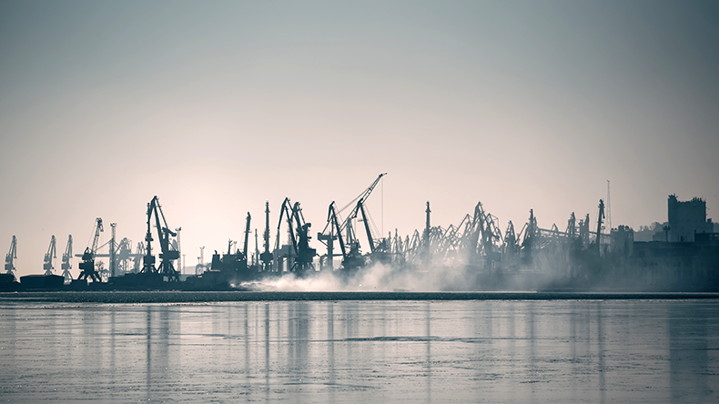 Mariupol port with smoke after a Russian attack