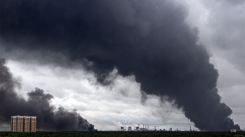  Black smoke rises from the area of the Russian oil producer Gazprom Neft's Moscow oil refinery on the south-eastern outskirts of Moscow on June 18, 2026.