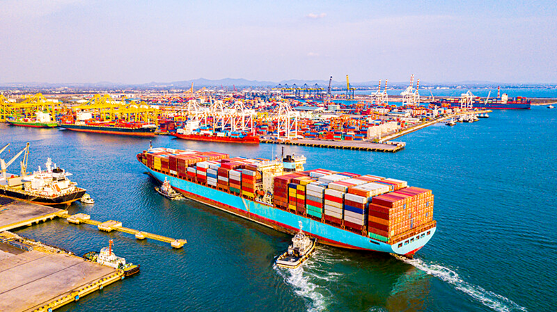 Containership entering a busy port