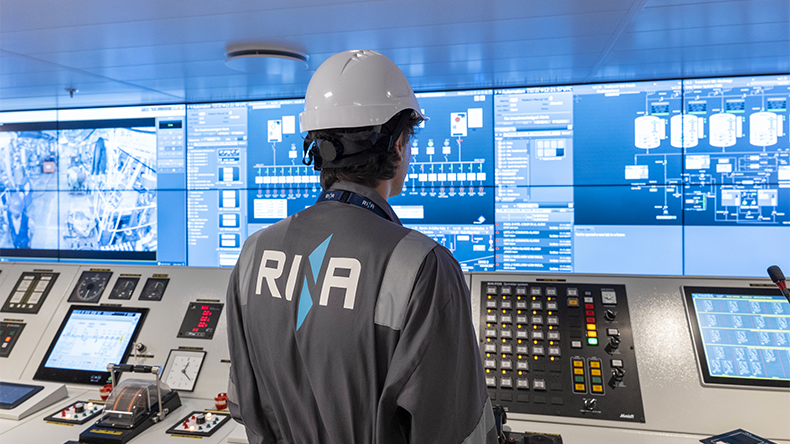 Rina worker using a ship's engine room technology controls